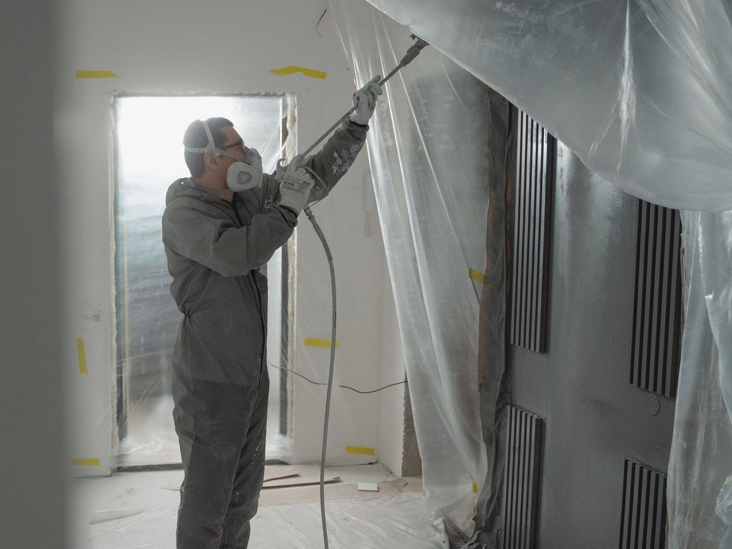 Interior spray painting with masking and floor protection (stock image)
